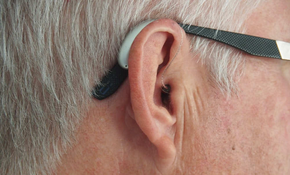 an elderly adult wearing glasses