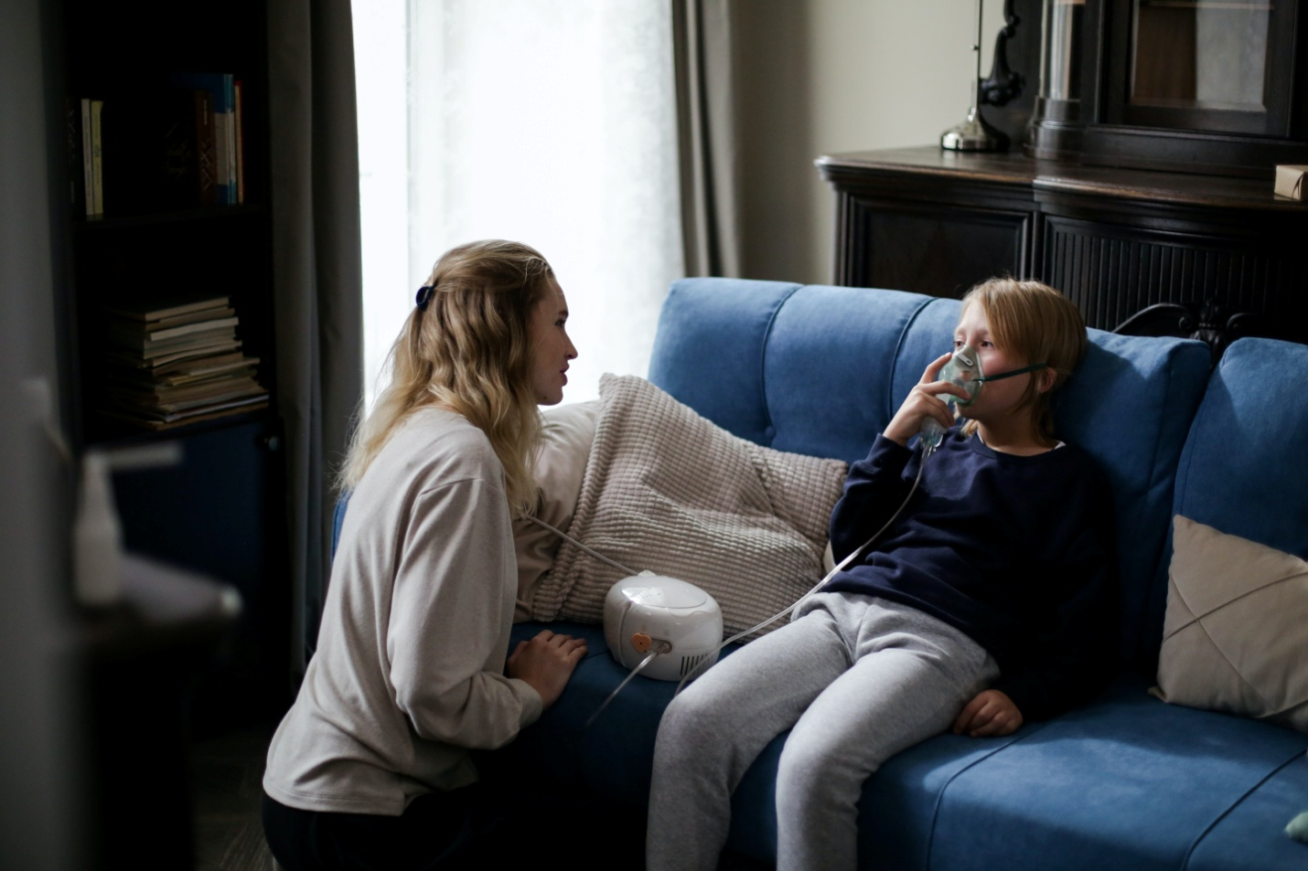 A child using a nebulizer at home