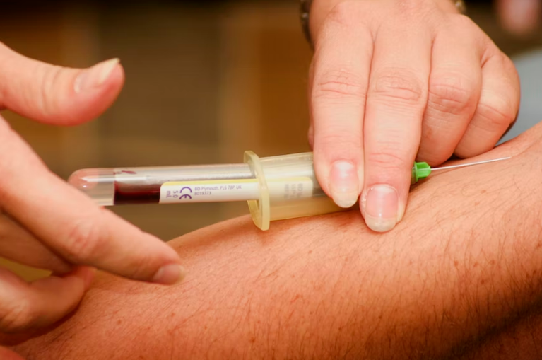 Blood being drawn by an urgent care doctor