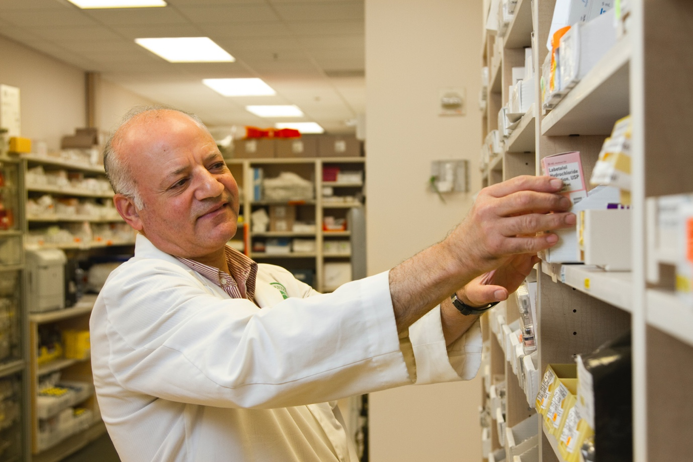 A chemist picking up medication at the pharmacy