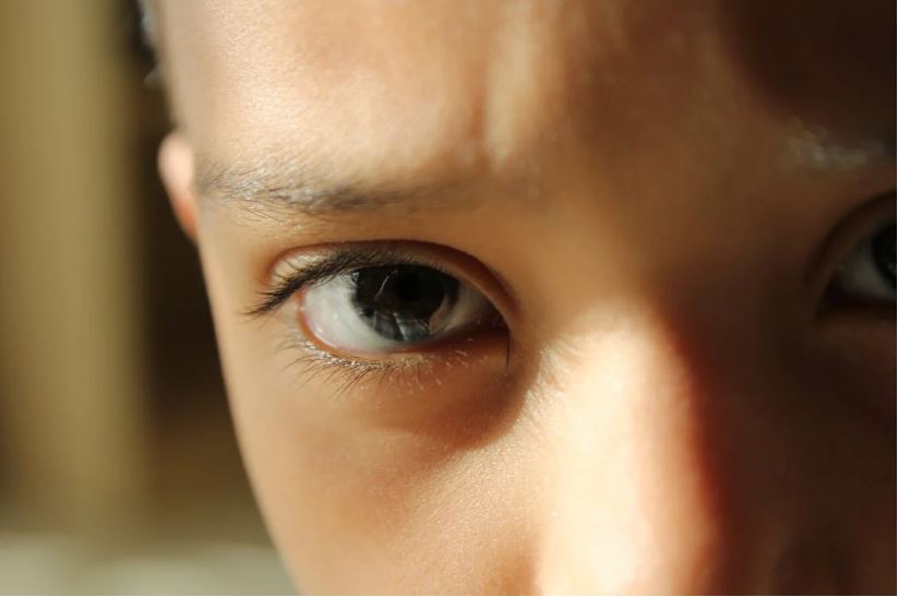 Sunlight hitting a child’s eye
