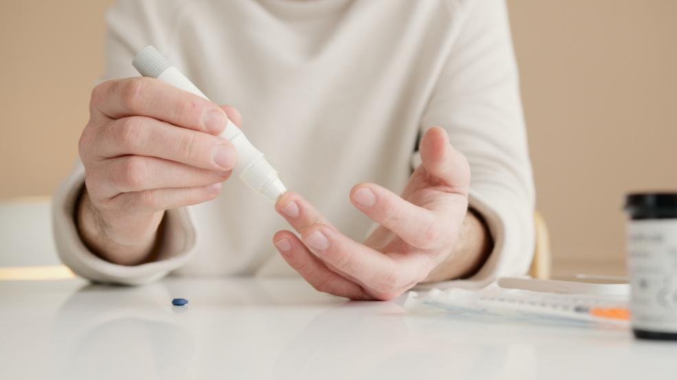 Close-up of a person testing their blood sugar level
