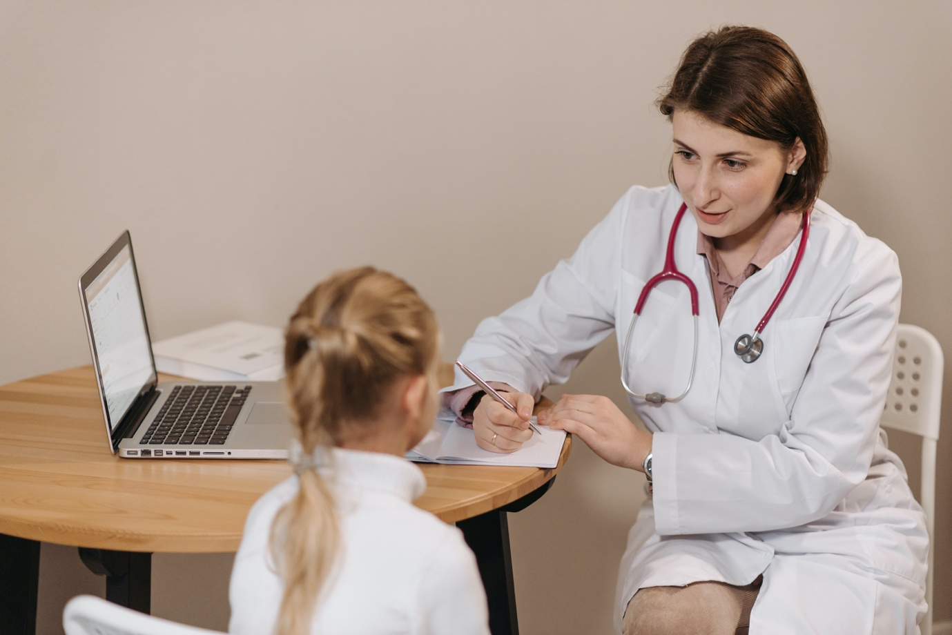 A doctor performing a medical check-up on a child