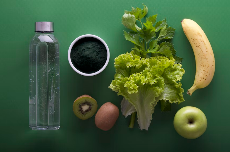 Fruits and veggies on a green surface