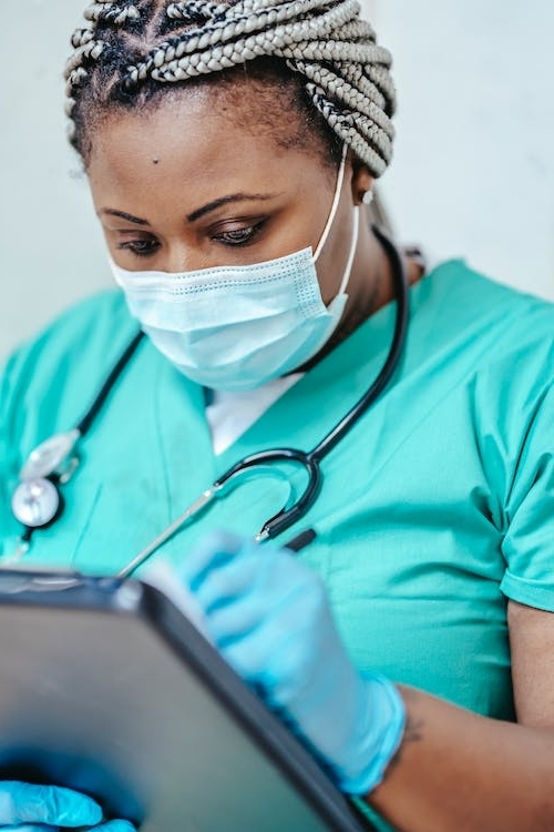 An image of an online doctor for allergies wearing a mask 