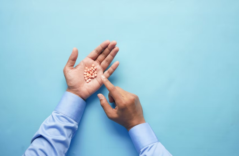 A handful of pink pills