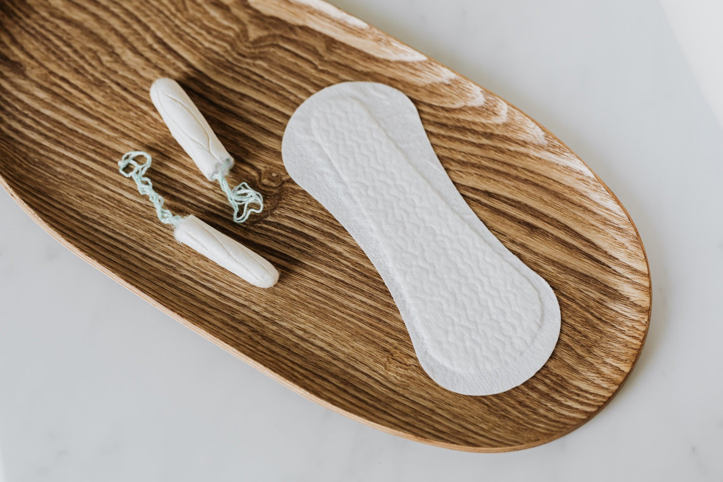 Products of personal hygiene for women on wooden stand