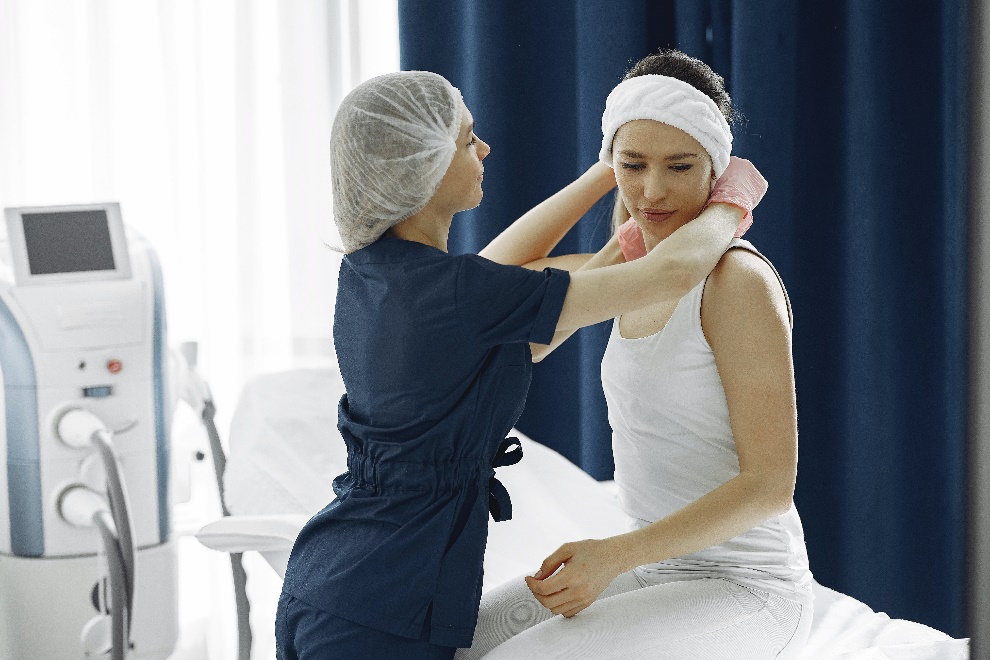 Healthcare provider helping a patient 