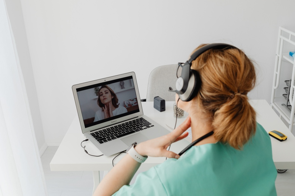 A person following a doctor's instructions on the video