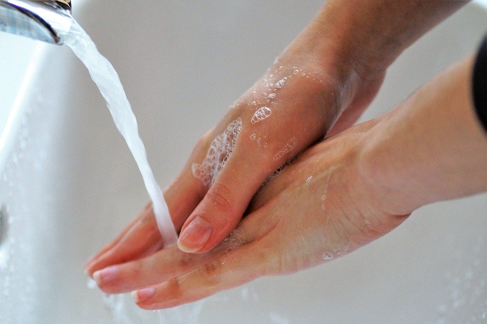 A person washing hands