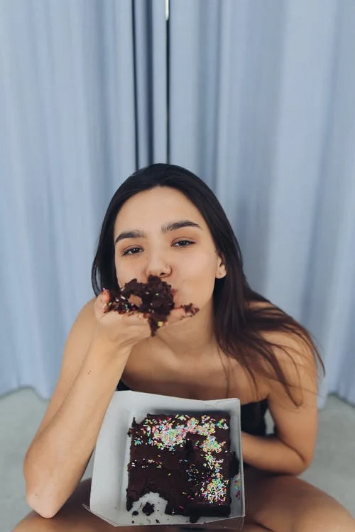 Woman eating chocolate cake