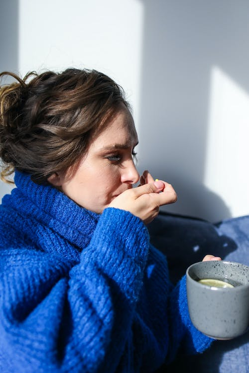 Woman getting nausea treatment online