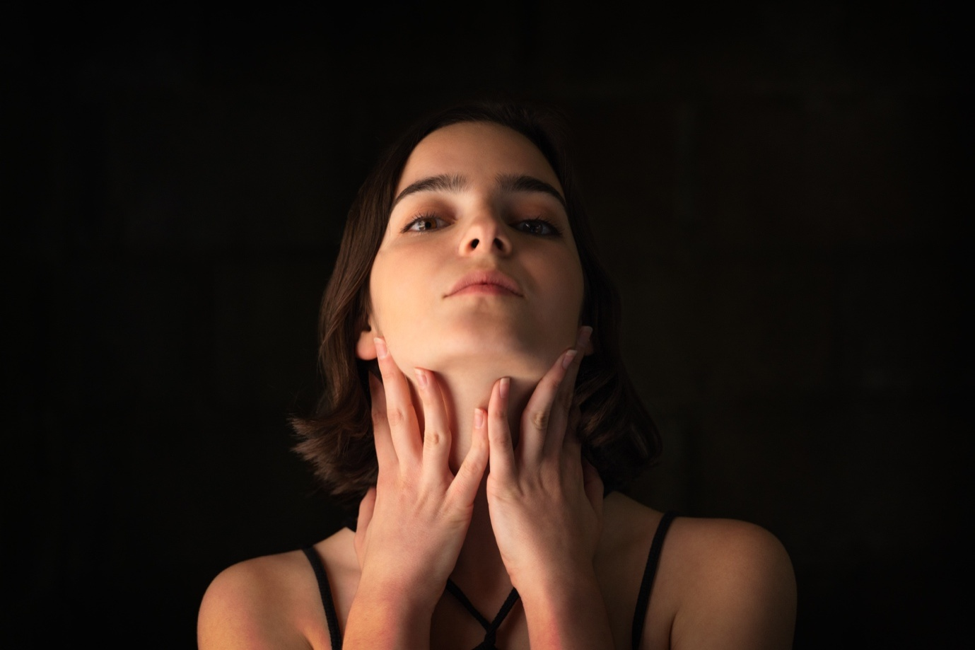 A woman holding her throat due to pain