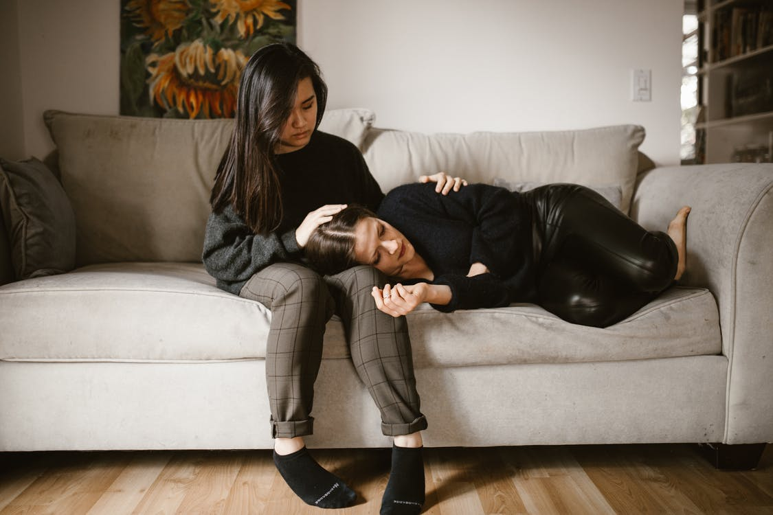 A woman comforting another woman