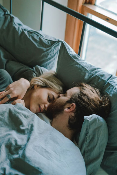 a woman on birth control being kissed by her partner