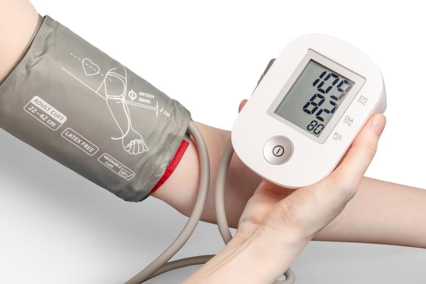 person checking their blood pressure