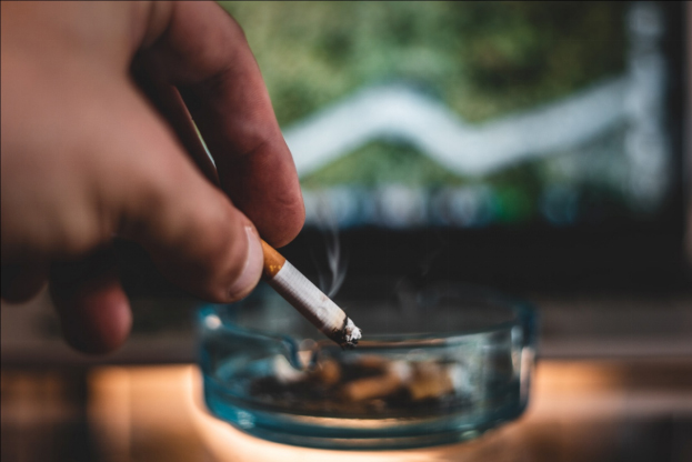a man putting out a cigarette