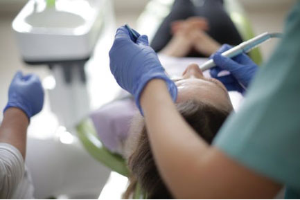 a dentist treating a patient