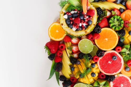 oranges, grapefruit, berries, banana, and other fruits