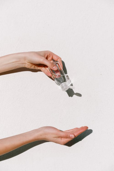 a person using hand sanitizer
