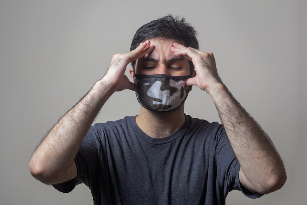 a am holding his head due to migraine