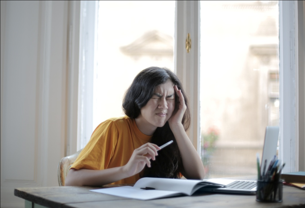 A woman suffering from a headache