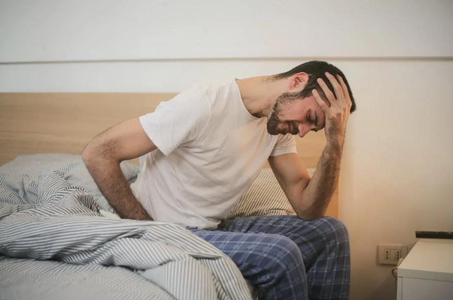 Person with headache in the morning.