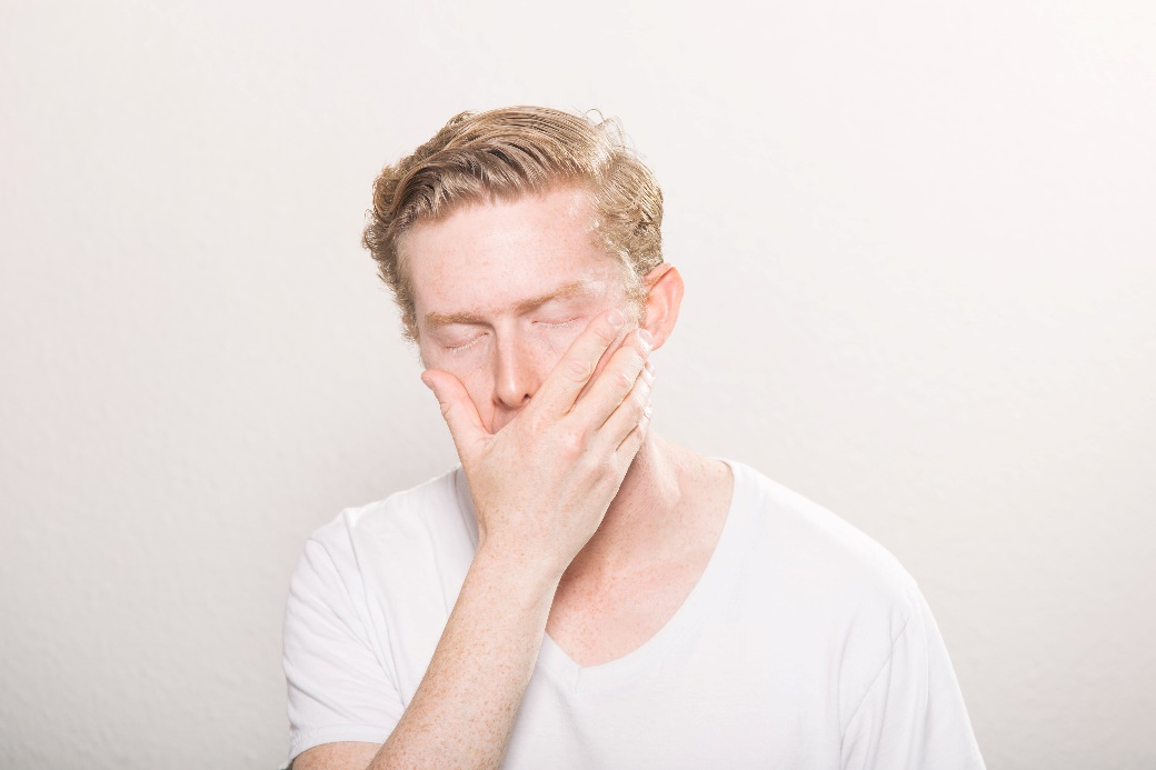 A person covering their mouth.