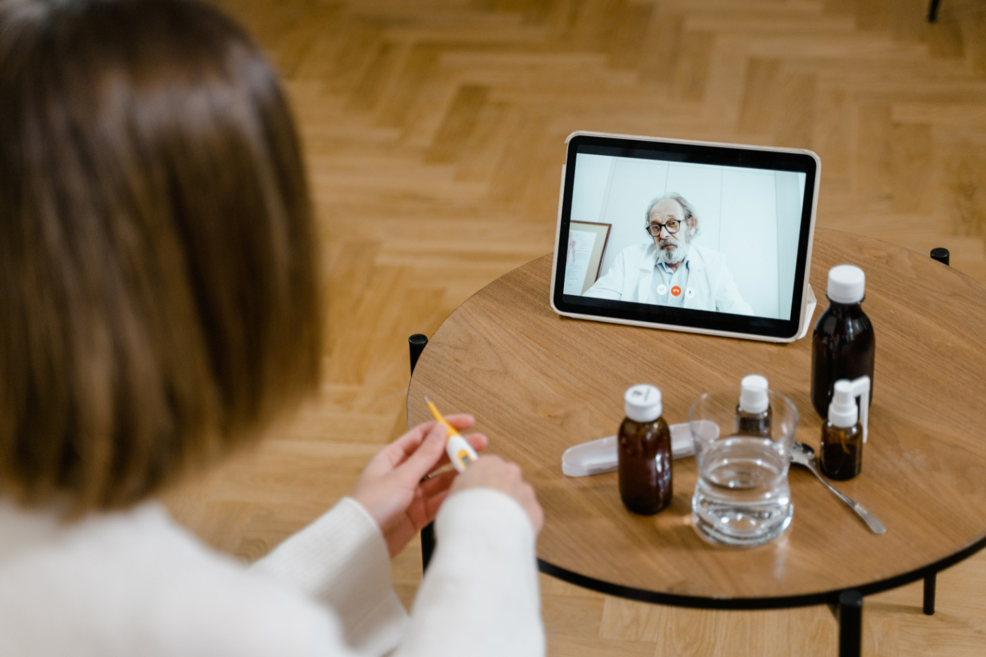 A woman consulting a doctor online