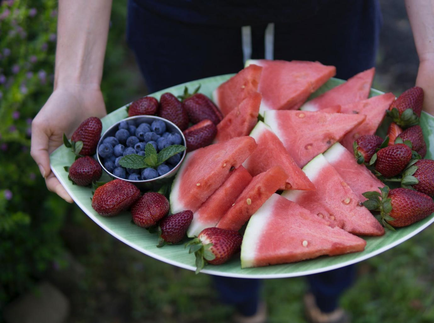 A plate filled with variety of fruits
