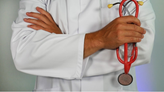 a doctor holding his stethoscope