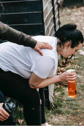 a girl vomiting