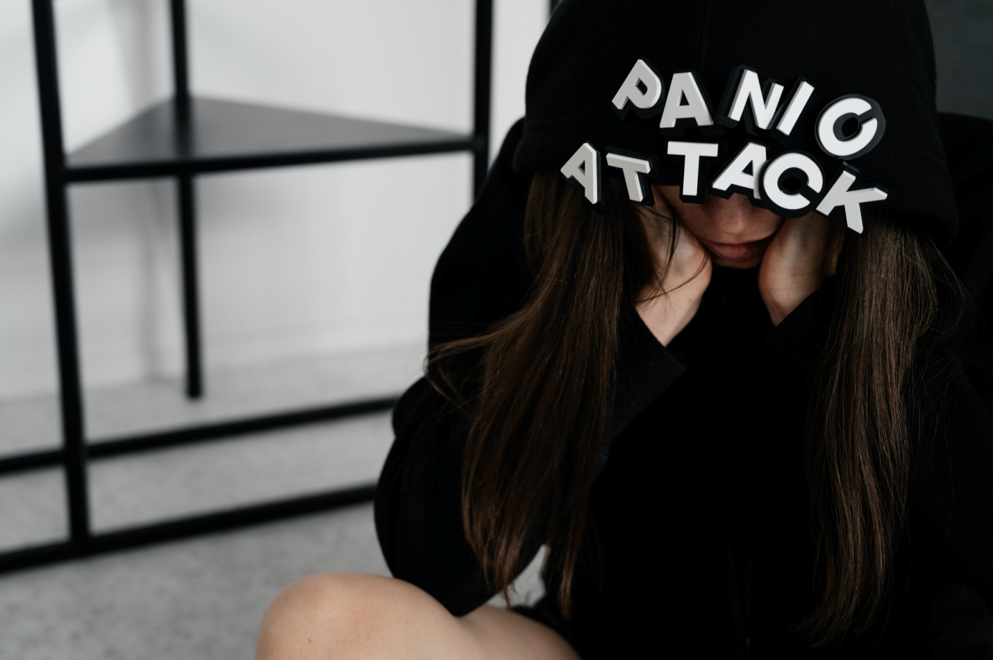 A woman wearing a black hoodie